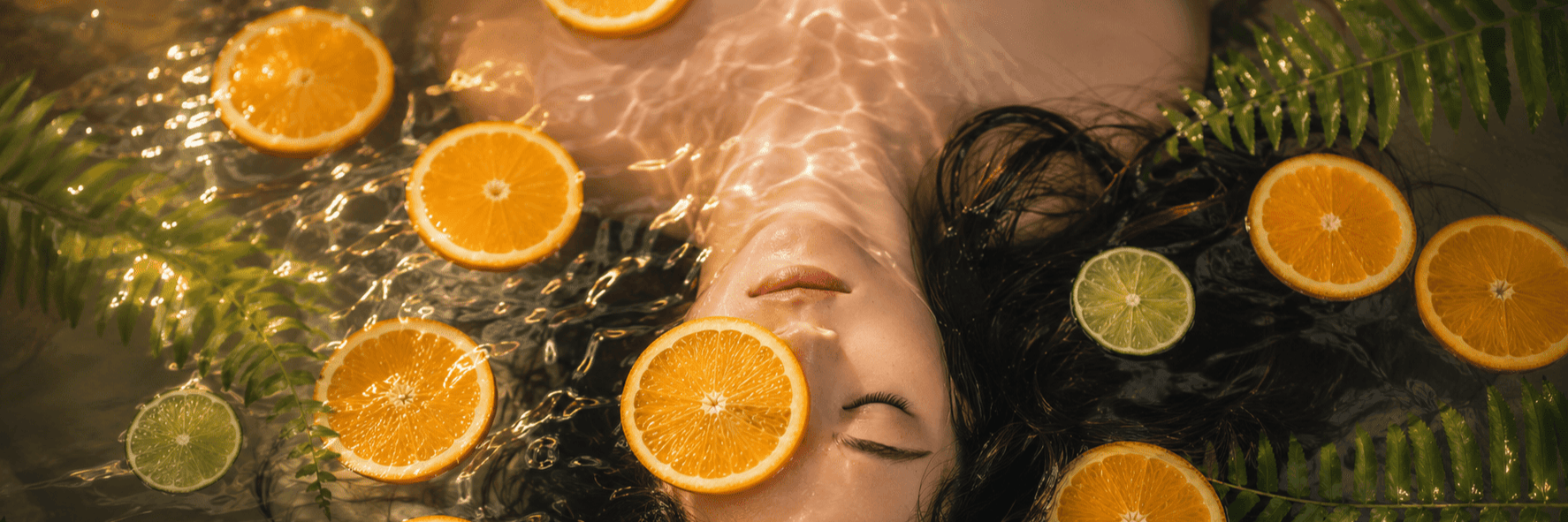 Floating candles and citrus slices in a tranquil spa arrangement